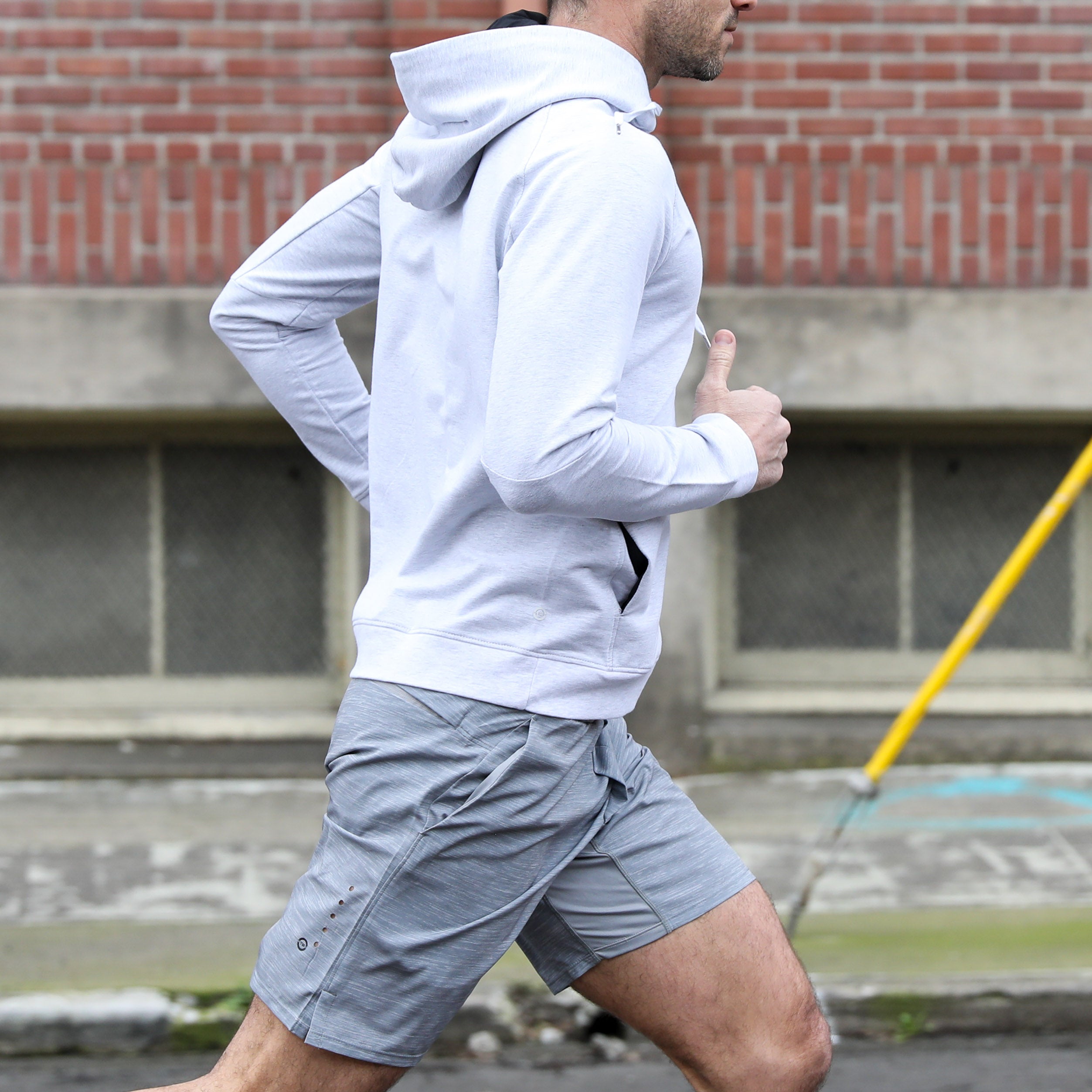 Man in Truwear mens hoodie and running shorts